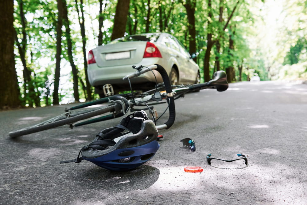 Bicycle and helmet on the roadway after a collision with a vehicle in Florida